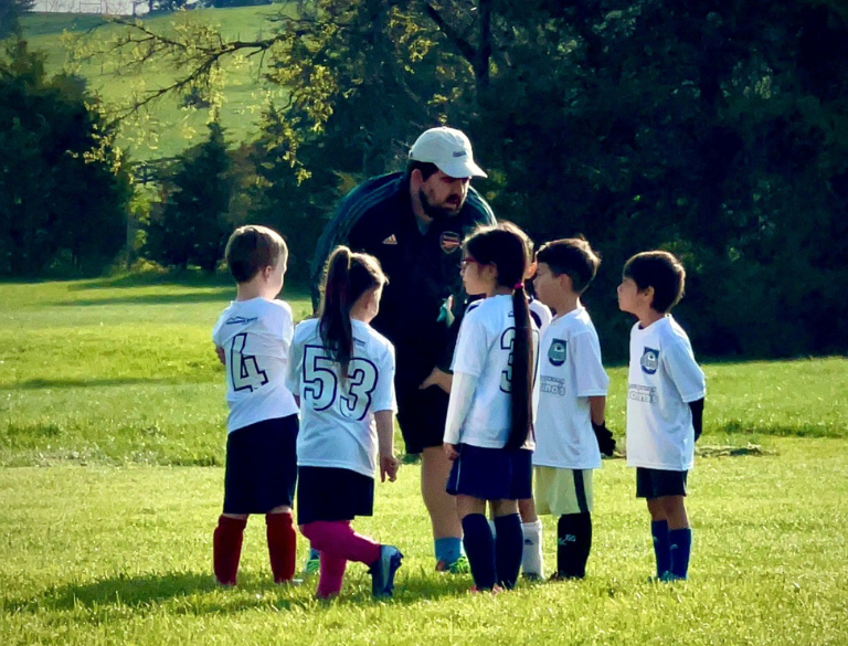 SVU coach instructing youth soccer players