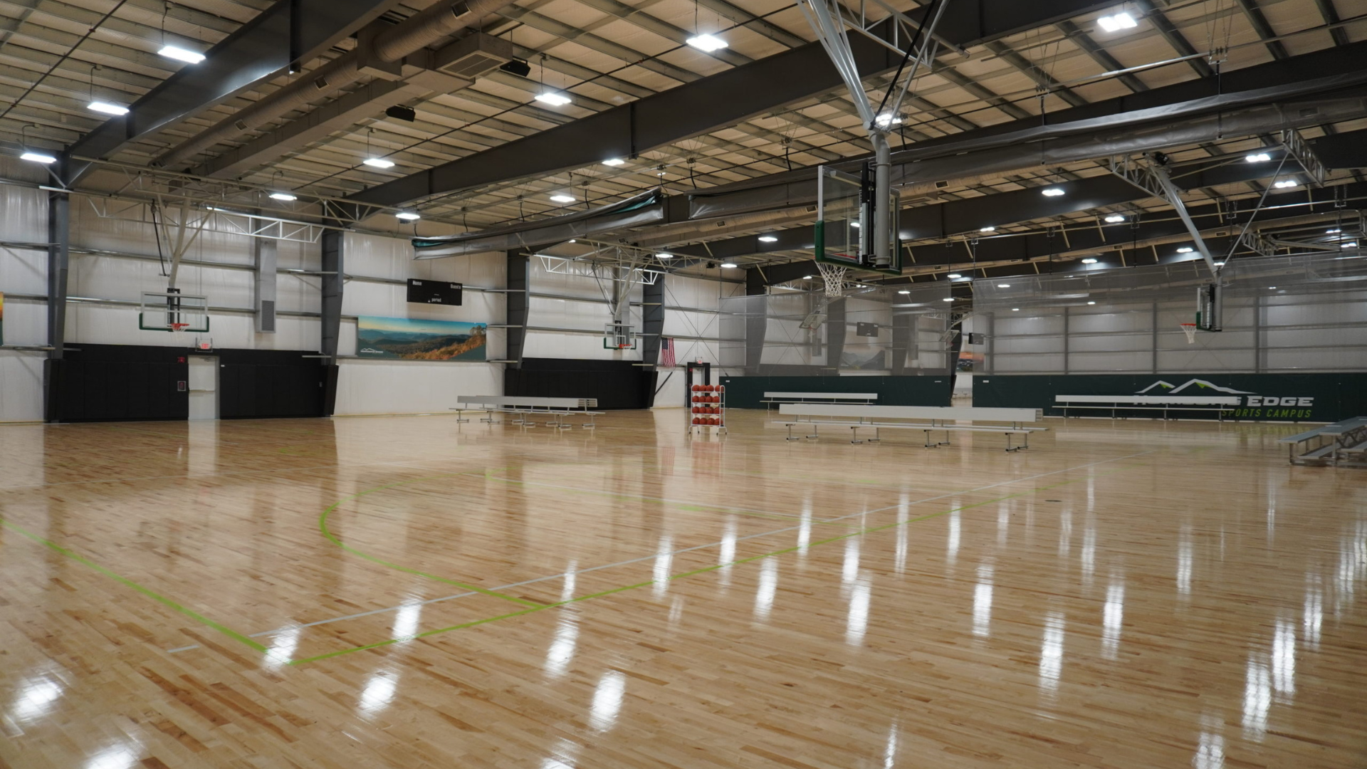 wide perspective image of the indoor basketball courts at horizons edge sports campus